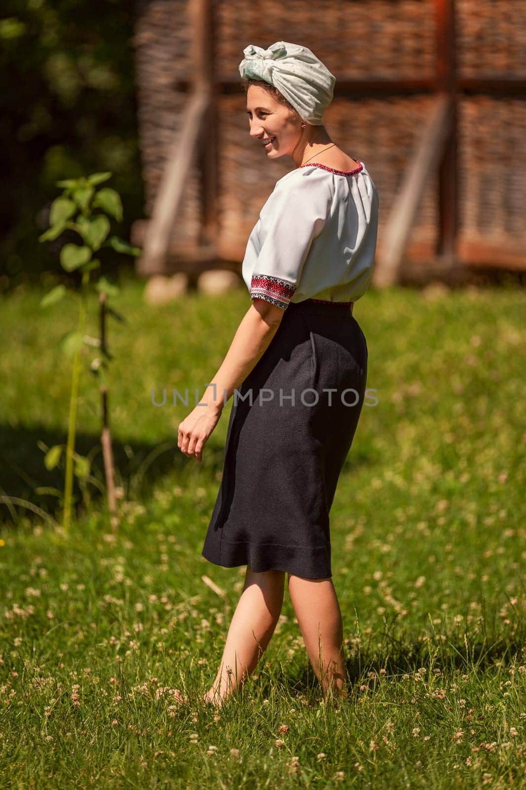 young woman in ukrainian national costume outdoors