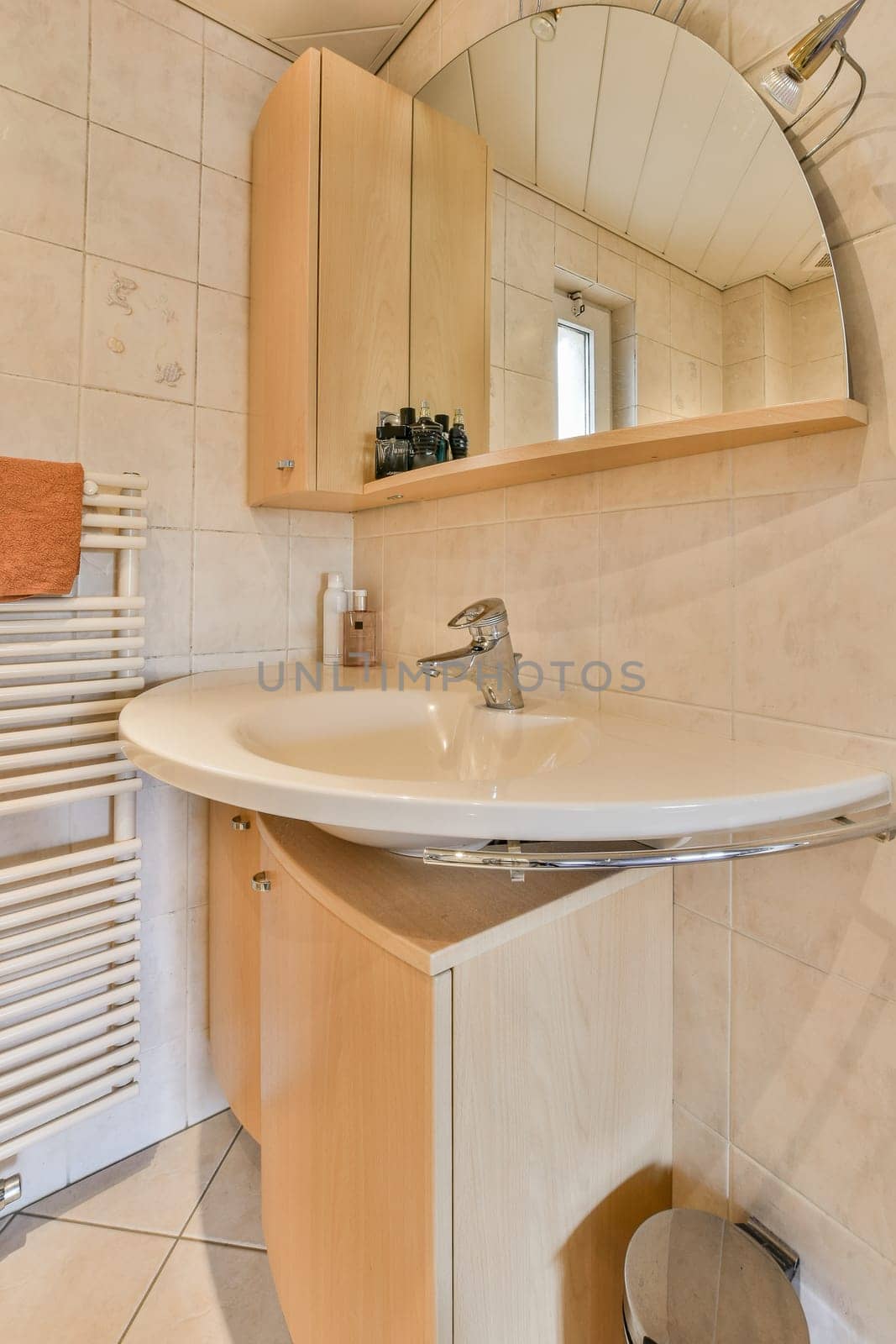 a bathroom with a mirror on the wall and a towel rack in the corner next to the sink is white