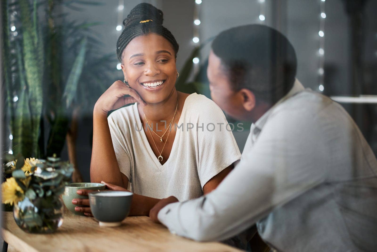 Love, black couple and talking at cafe with coffee on romantic date. Coffee shop, communication and romance of man and woman speaking, discussion and having a conversation while drinking espresso