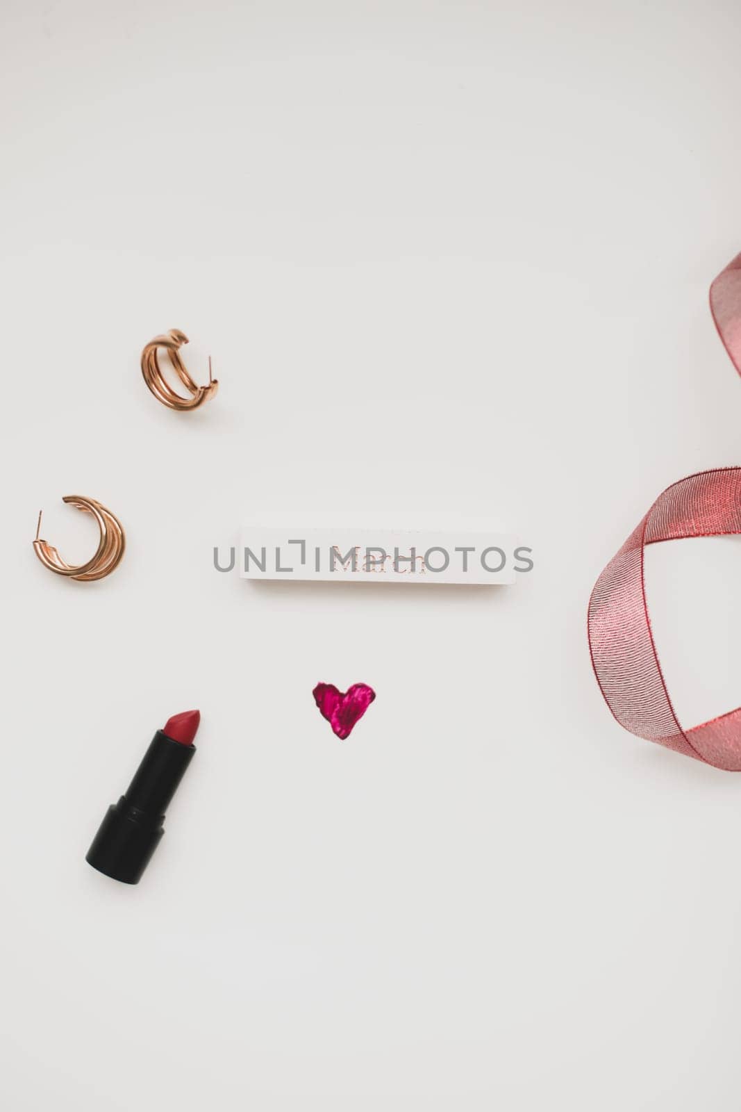 Concept Women's Day, Valentines Day, March 8. Lipstick, cosmetic makeup products and accessories flatlay top view. by paralisart