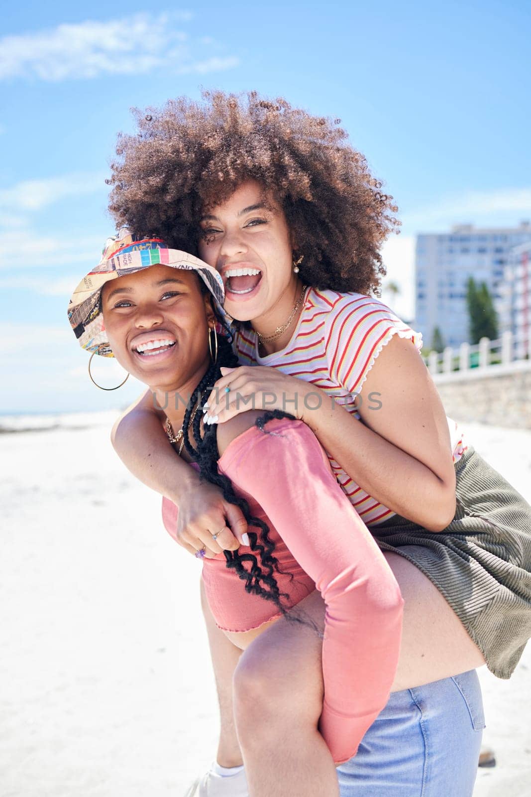 Friends, gay and lesbian with women happy on piggyback and fun at beach in summer. LGBTQ, dating and trust with happy female and her girlfriend on holiday, vacation or travel by the coast in summer.