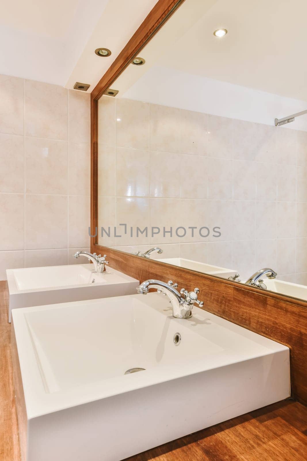 a bathroom with two sinks and a mirror on the wall next to the bathtub is in front of it