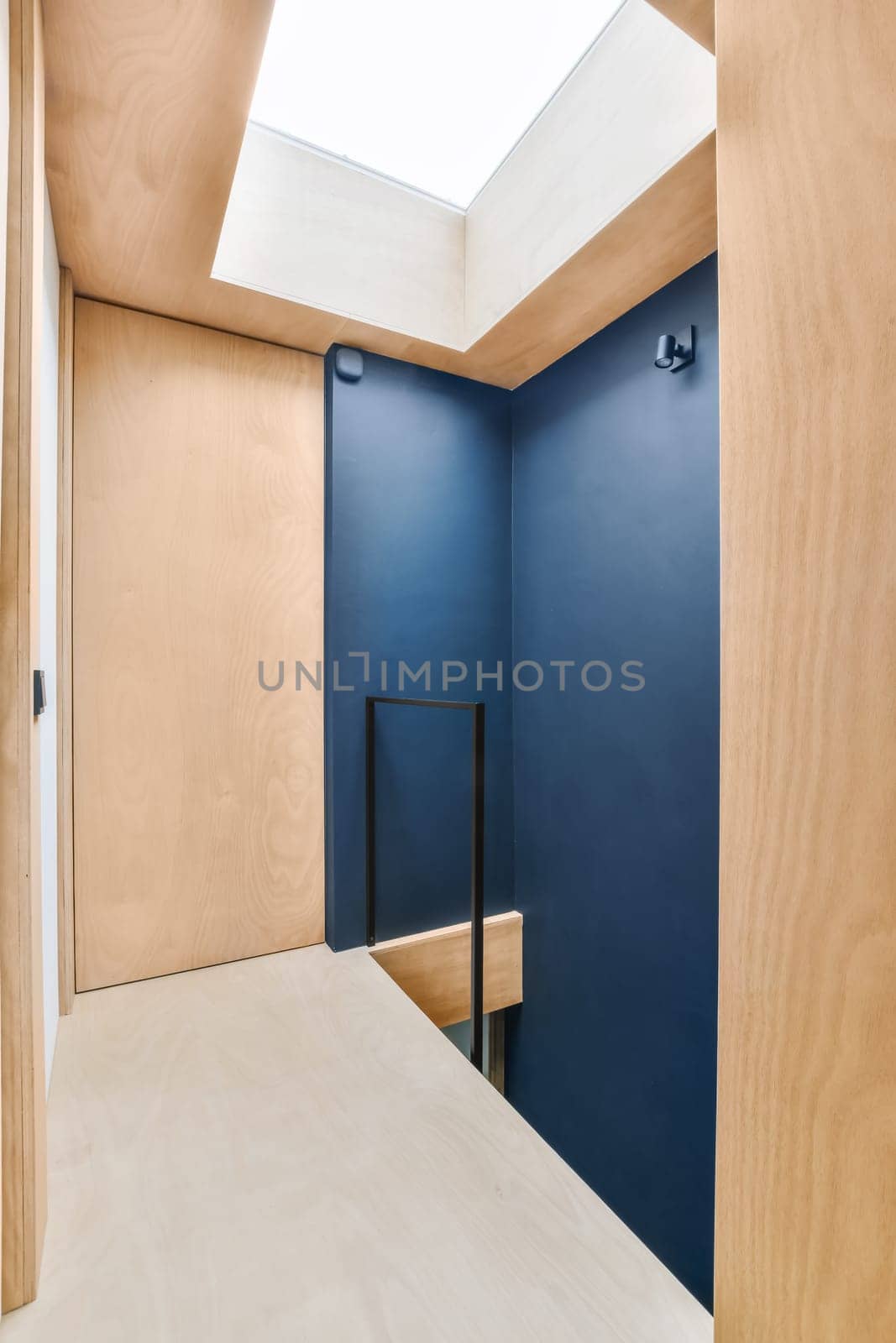 a blue room with a table and a blue wall by casamedia