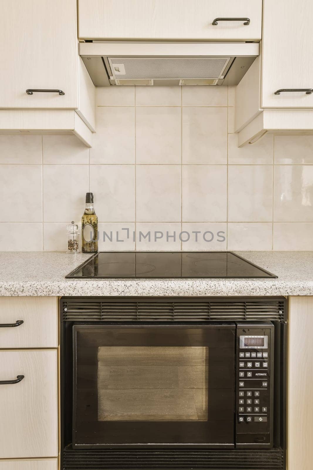 a kitchen with a microwave oven and a counter top by casamedia