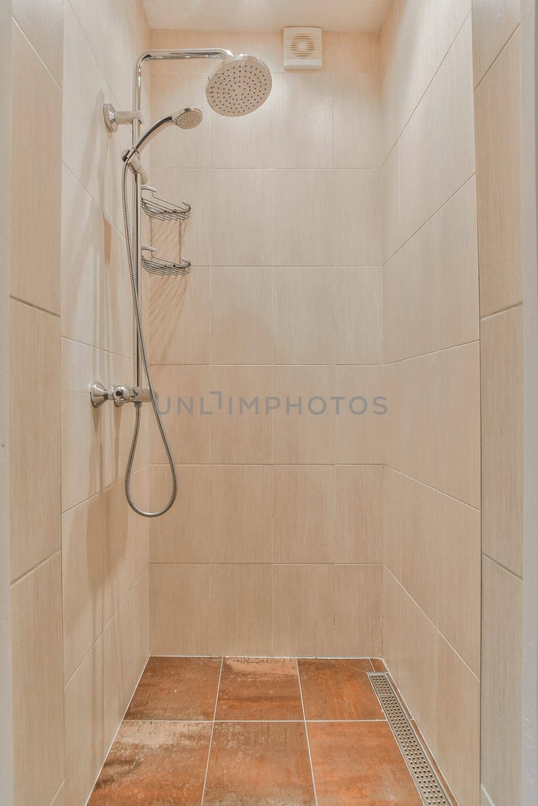 a shower with tile on the floor and tiled walls in an open space that looks like it's been done