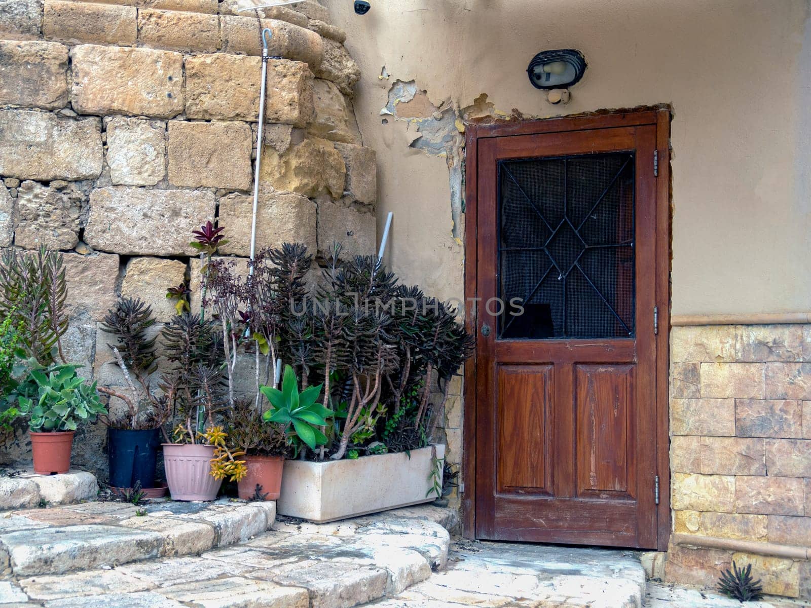 close up retro style old house door of Mediterranean architectural culture in Mediterranean island Malta. High quality photo