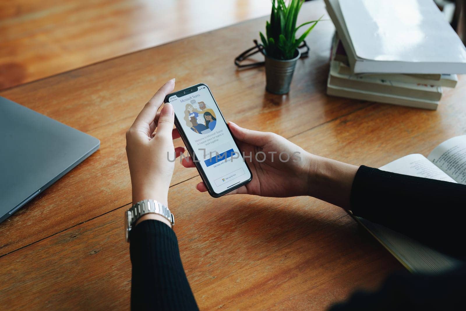 CHIANG MAI, THAILAND - Jun29, 2022 : A working from home employee is downloading the Microsoft Teams social platform, ready for remote working in isolation from home.