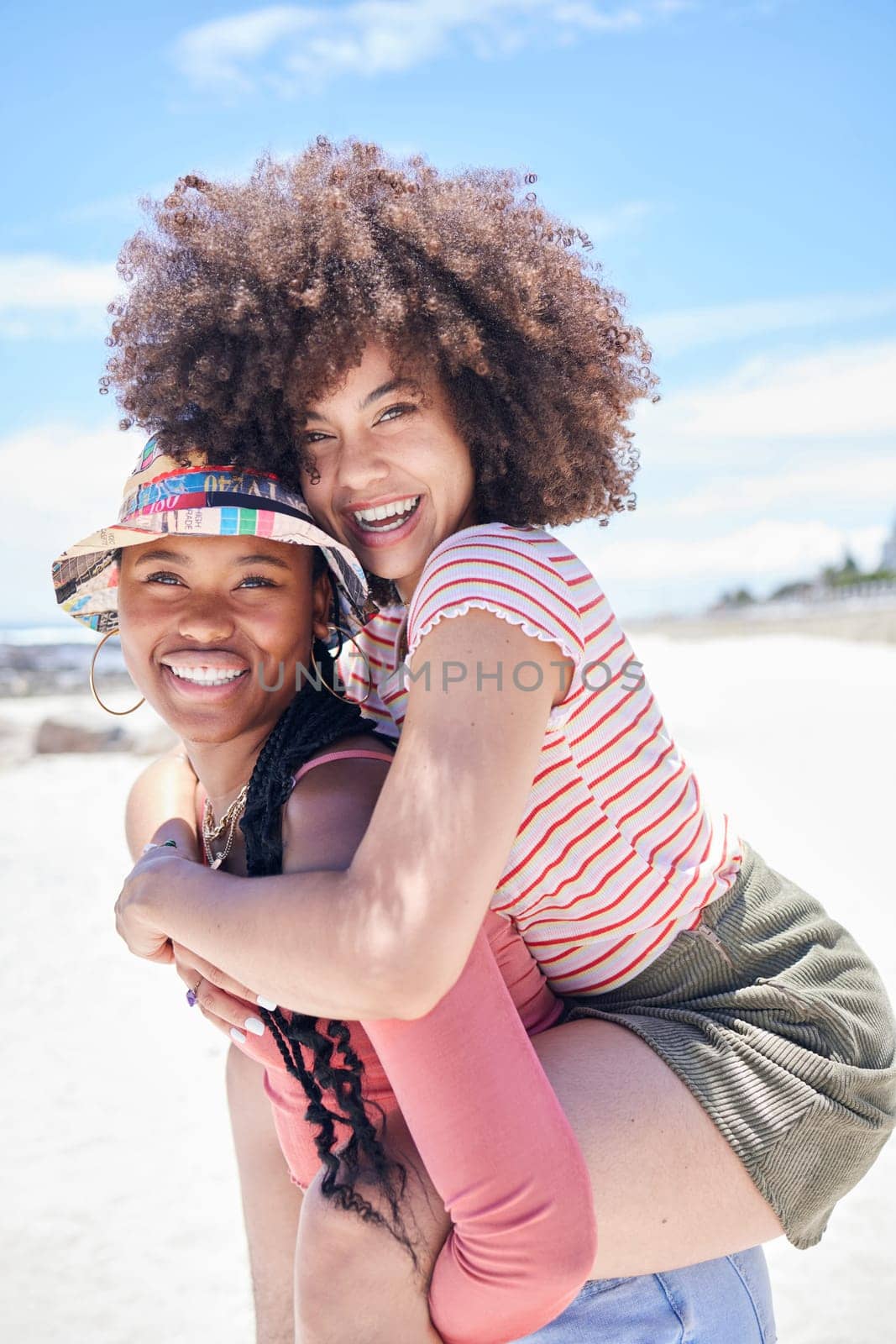 Piggyback, portrait and friends on holiday at the beach during travel in the Maldives together. Happy, relax and playful African women with smile during vacation by the ocean and sea in summer.