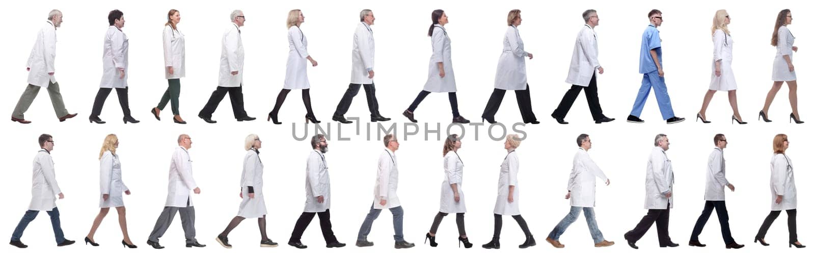 group of doctors in motion isolated on white background