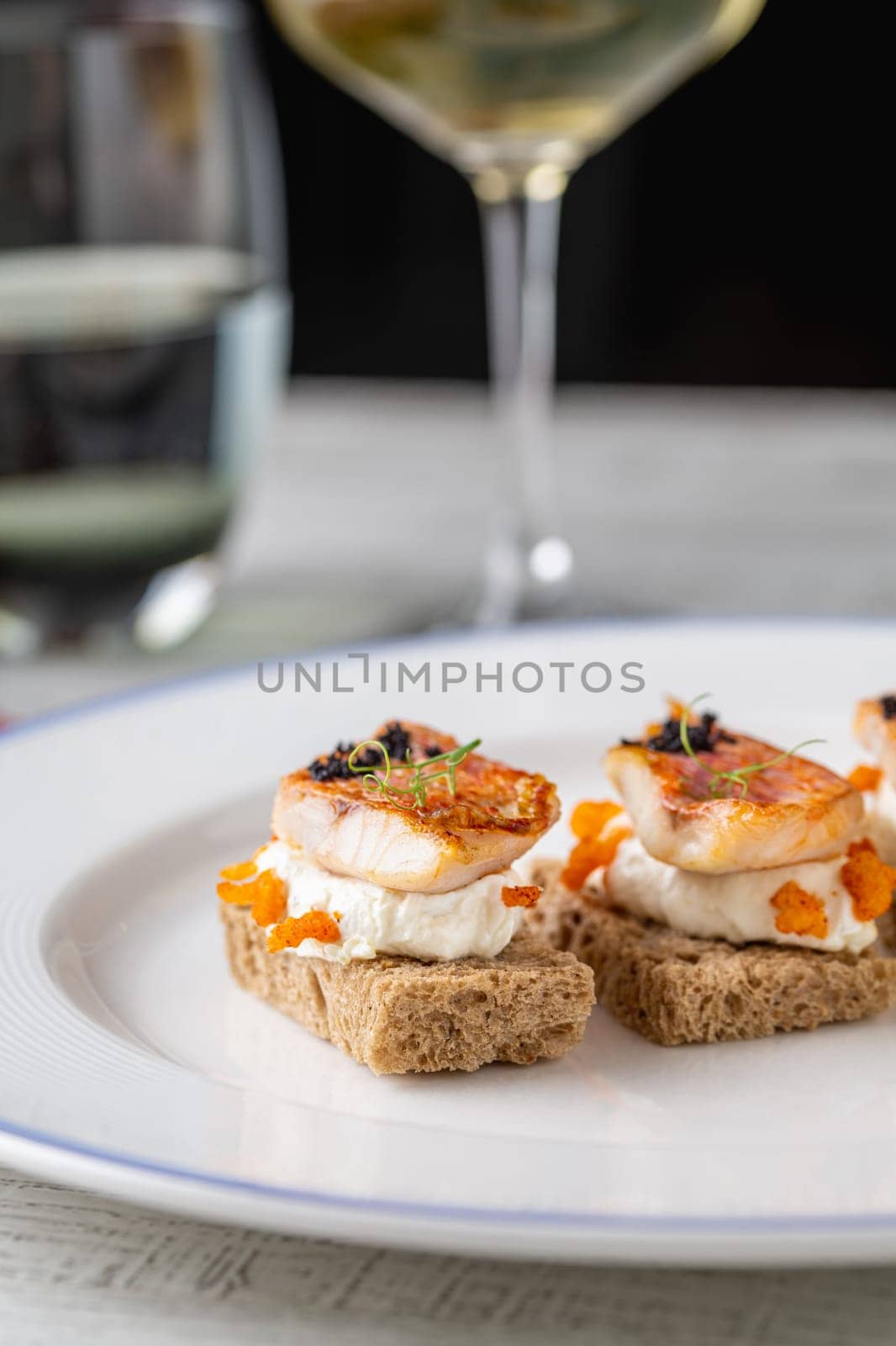 Red mullet with mash sauce on slices of bread in fine dining restaurant