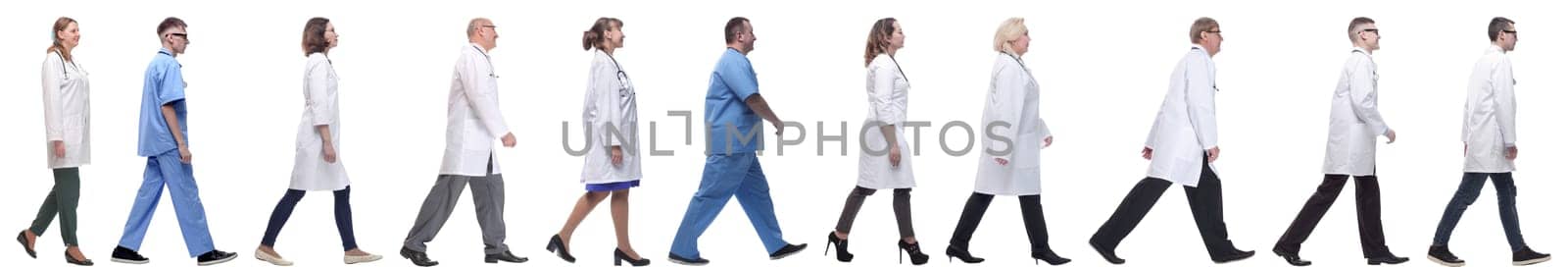 group of doctors in motion isolated on white background