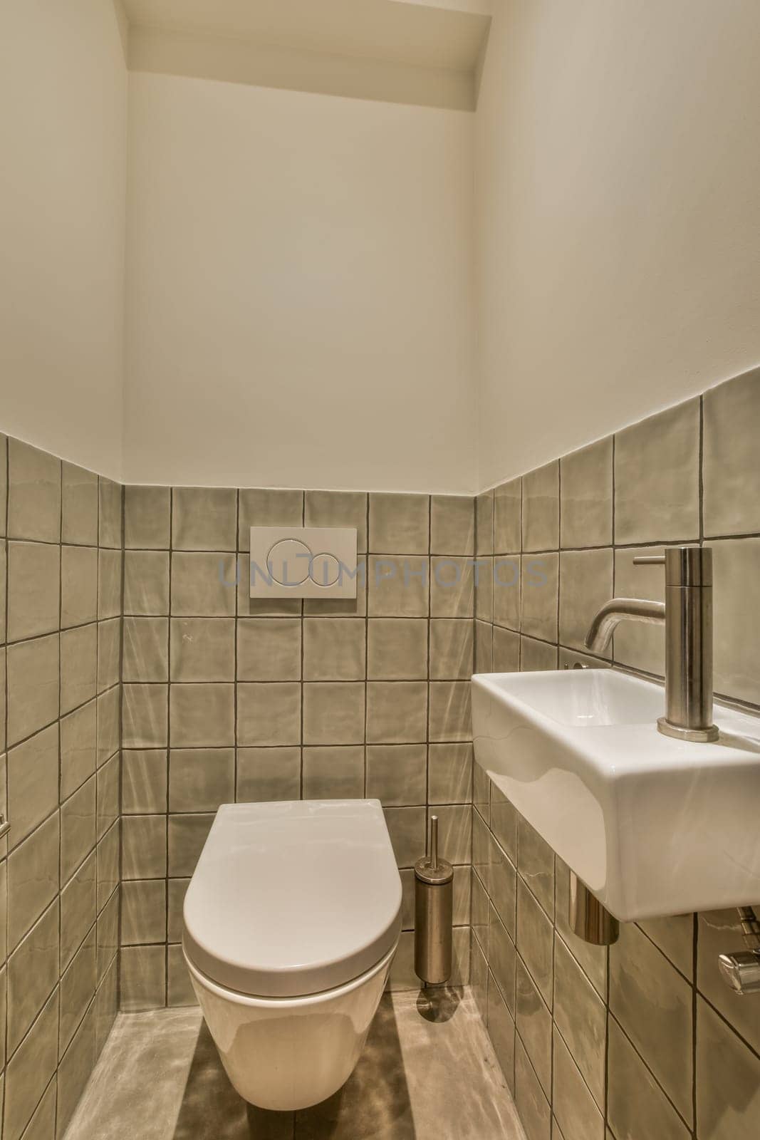 a small bathroom with a toilet and a sink by casamedia