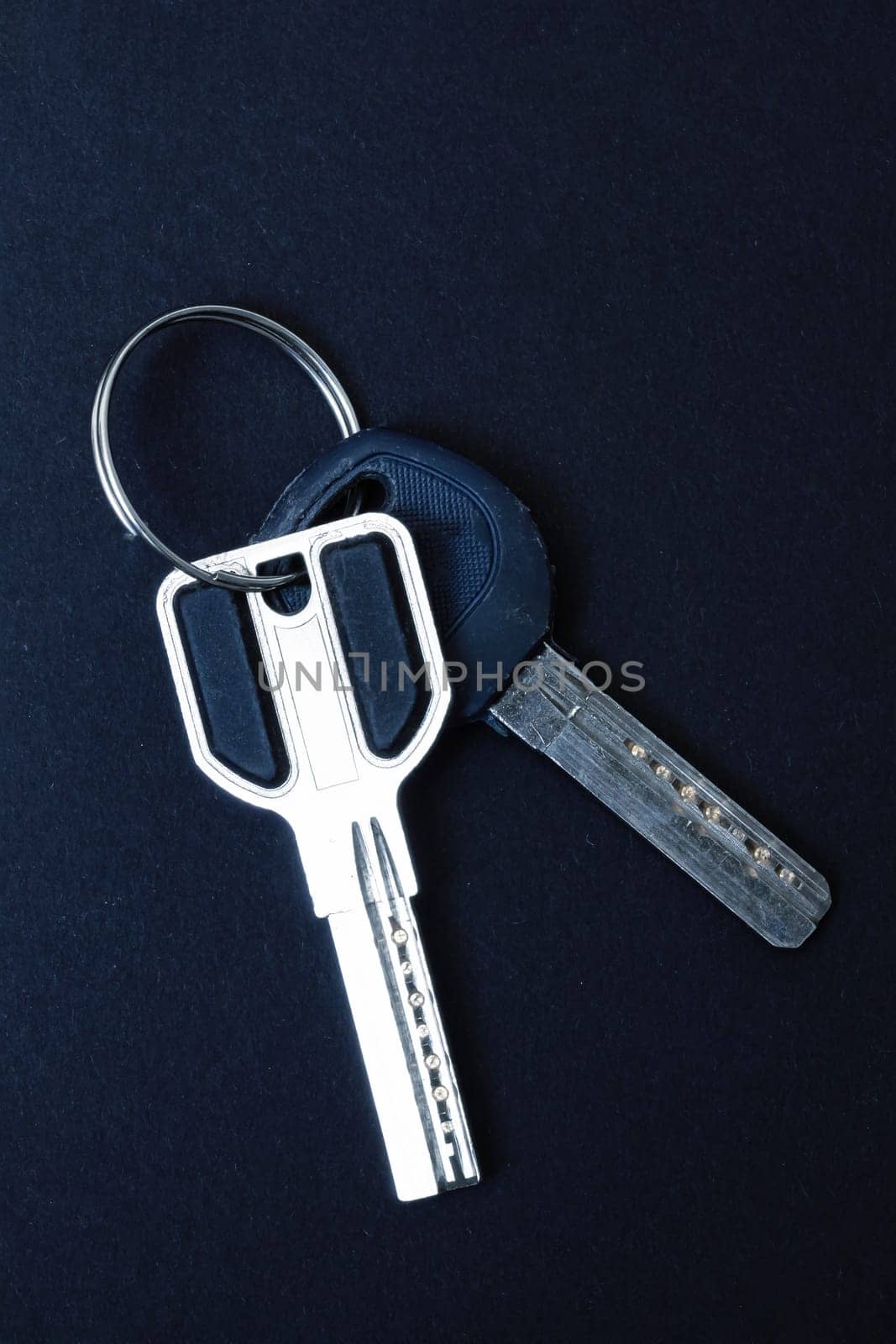 Door keys on a black background close up, copy space