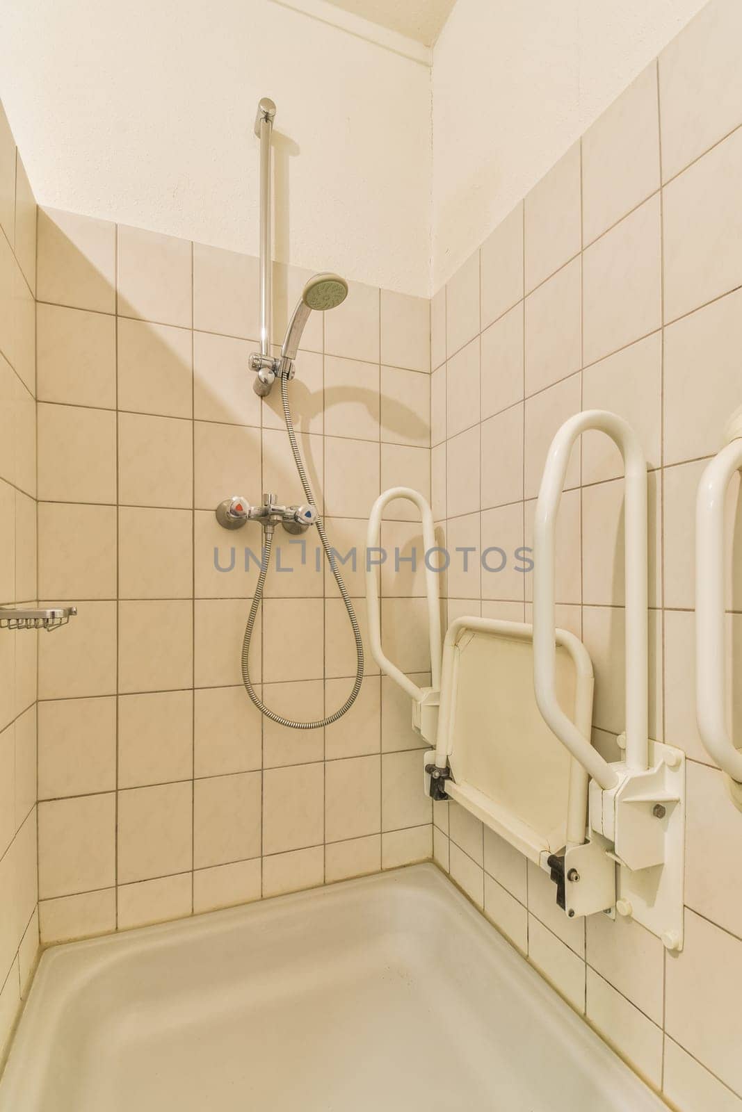 a bathroom with a shower and a wheelchair in it by casamedia