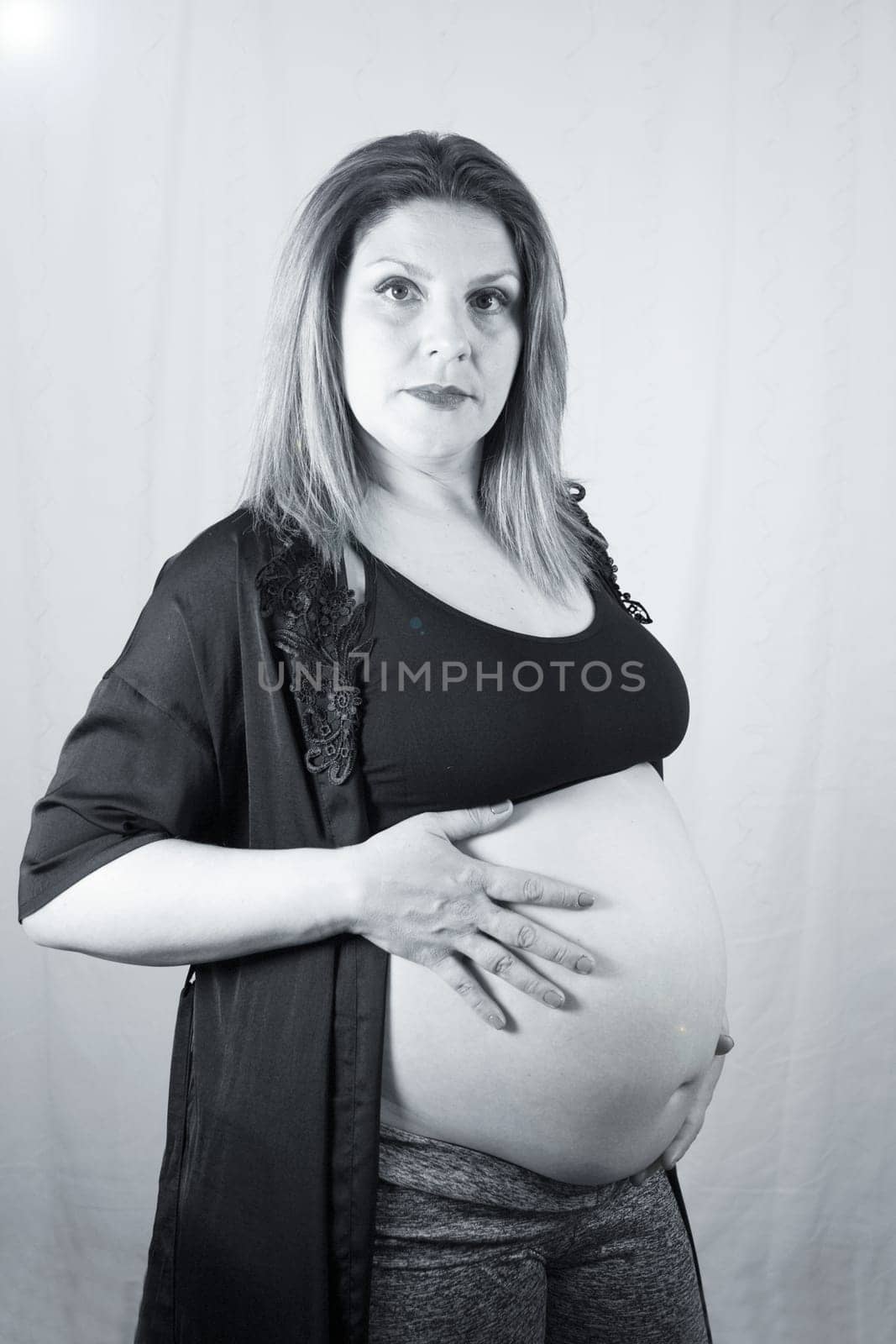 Eight months pregnant woman posing in black clothes by GemaIbarra