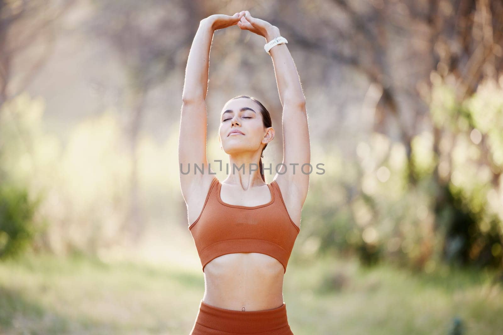 Meditation, yoga and zen woman in nature relaxing, training or stretching her body with freedom for a calm balance. Fitness, pilates and peaceful girl in a park to meditate for a mindfulness exercise.