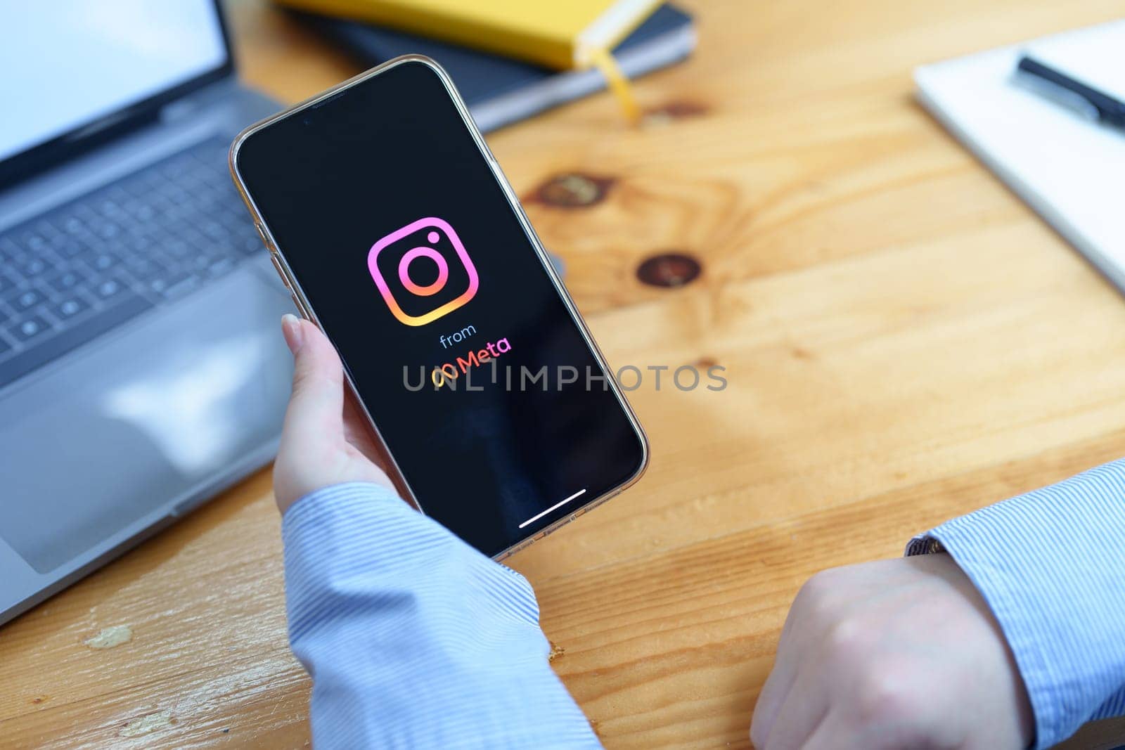 CHIANG MAI, THAILAND - Jun 30, 2022 : woman hand holding smartphone mobile with login screen of instagram application. Instagram is largest and most popular photograph social networking.