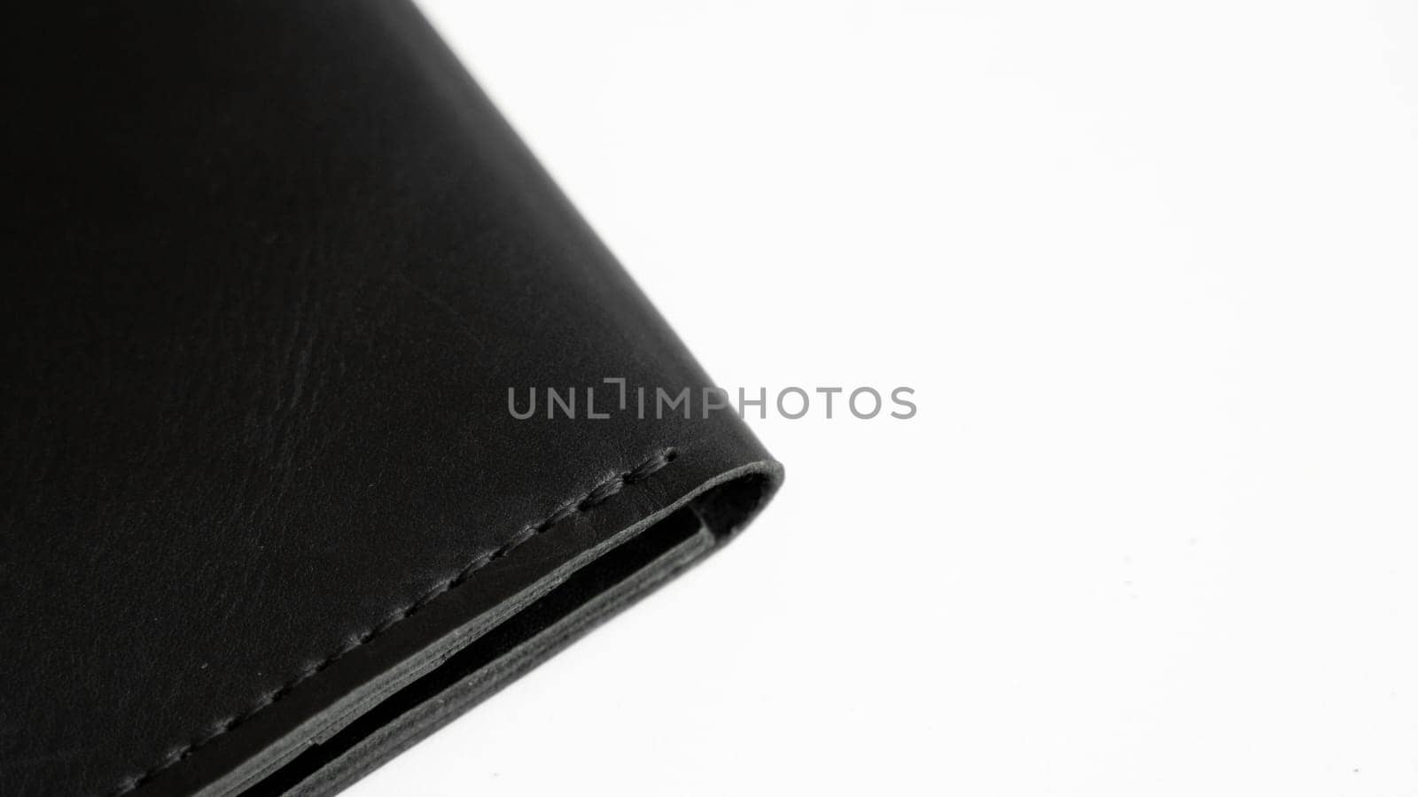 Details of open handmade brown man's genuine leather wallet with zipper on a button for banknotes and credit cards isolated on white background. by vovsht
