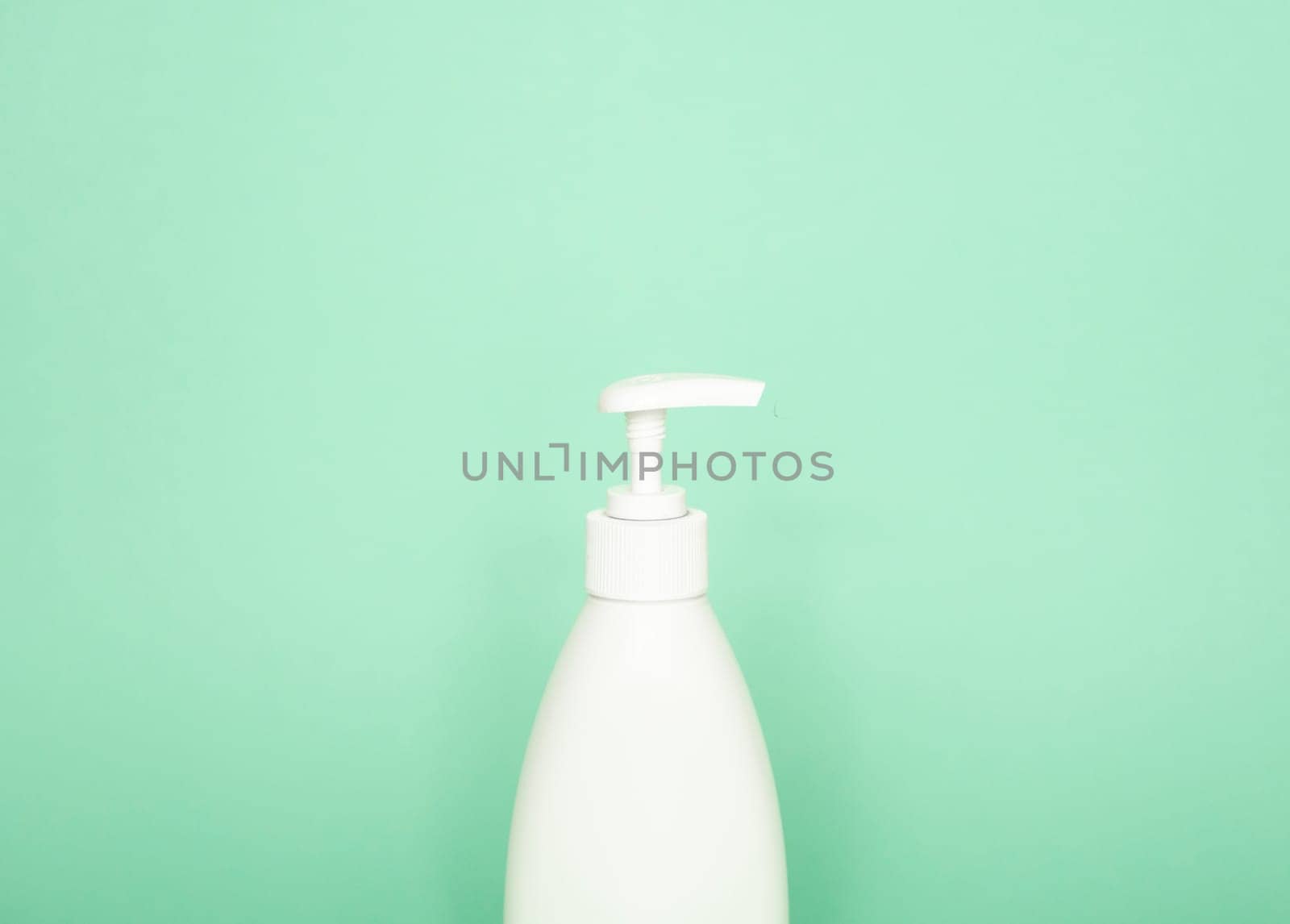 Blank unbranded cosmetic plastic bottle with dispenser pump for shampoo, gel, lotion, cream, bath foam