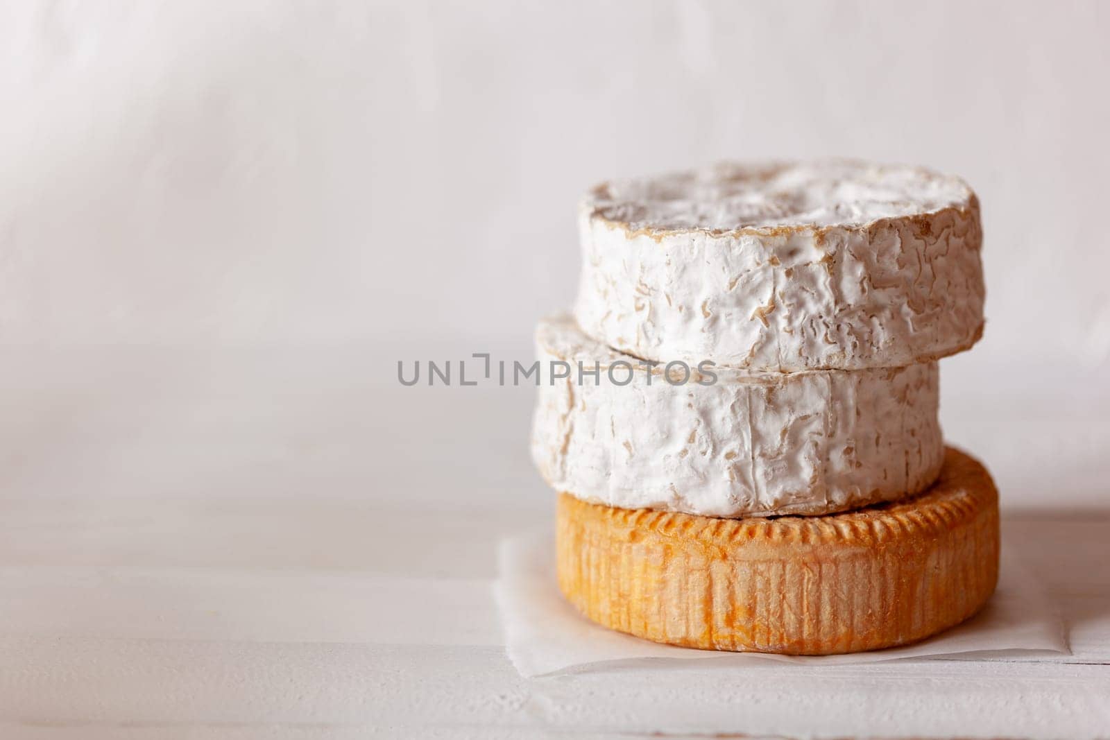 stack of soft french goat cheese camembert style