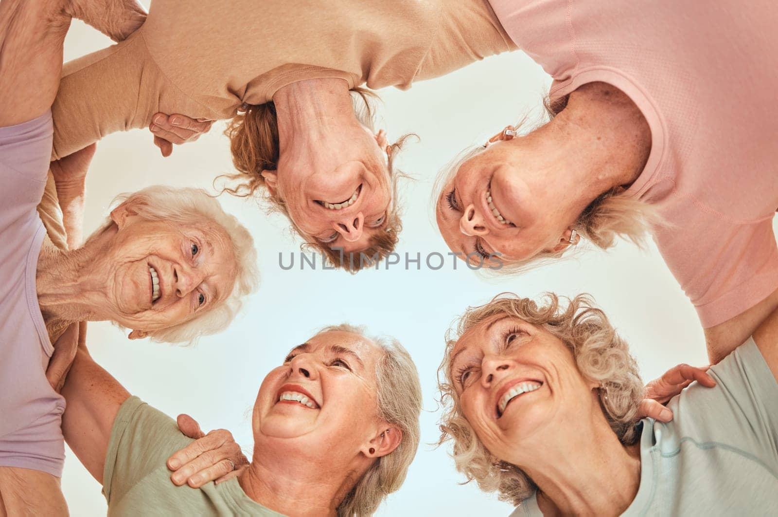 Fitness, goals and senior women in a circle for team building, motivation and community support. Retirement, below or happy elderly friends with mission after yoga class training, workout or exercise by YuriArcurs