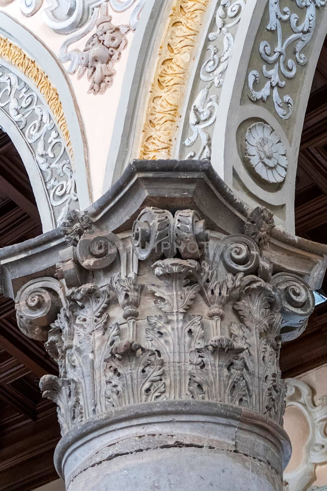 The capital of an old column in the church. Vertical view by EdVal