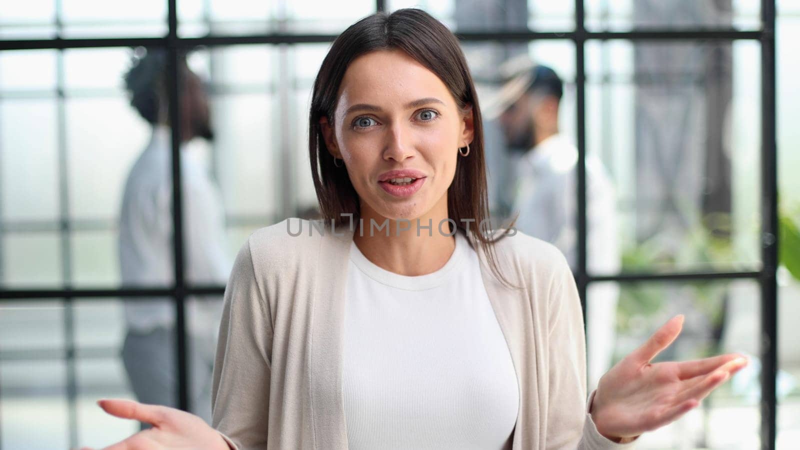 Face of beautiful woman on the background of business people