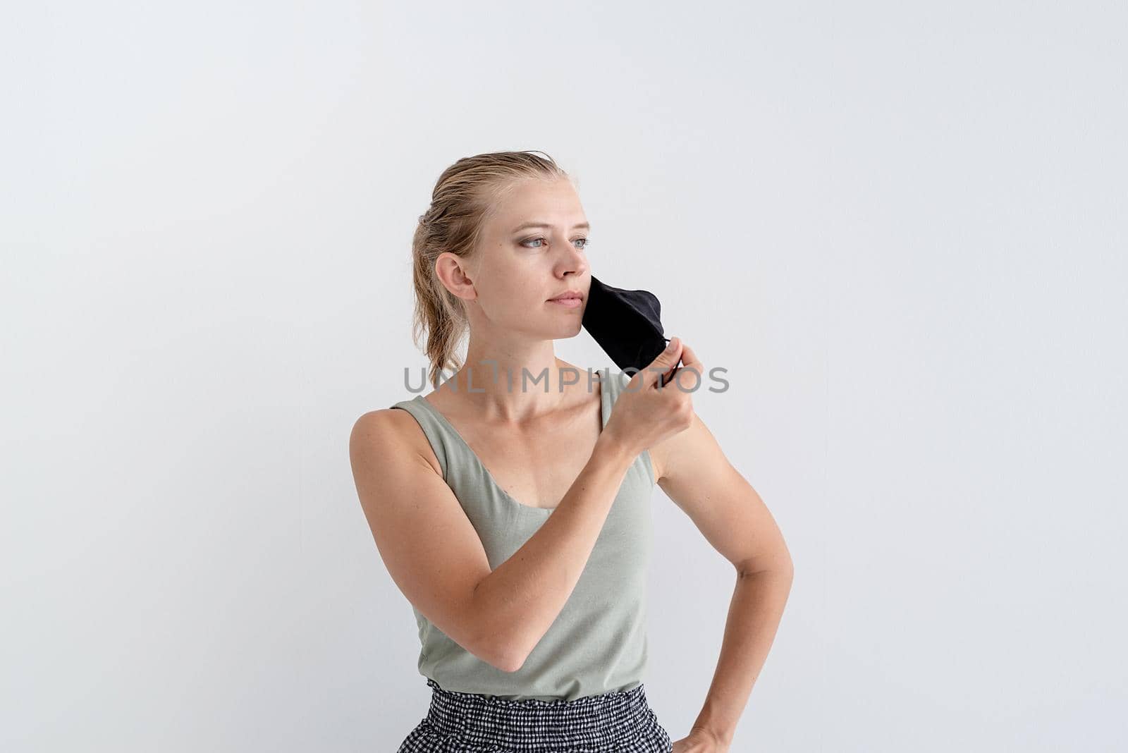 Healthcare concept. Young woman in a protective mask, portrait, close up. Copy space