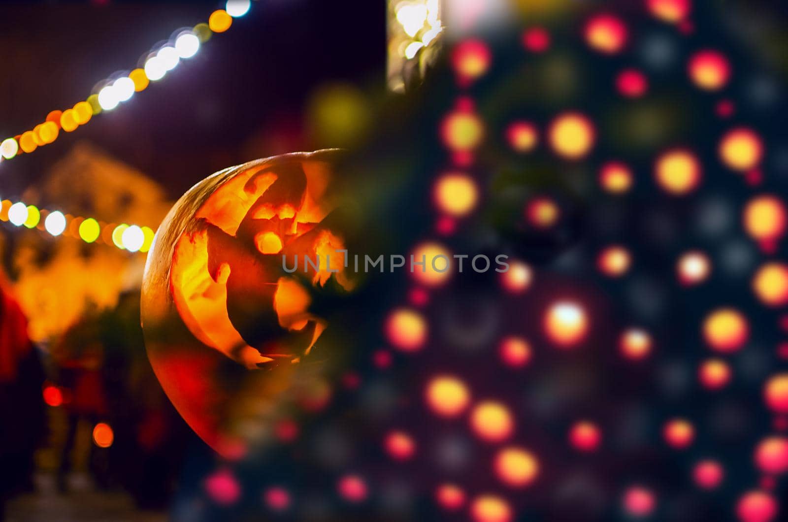 Happy Halloween banner with pumpkin on abstract blurred bokeh light background. by KajaNi
