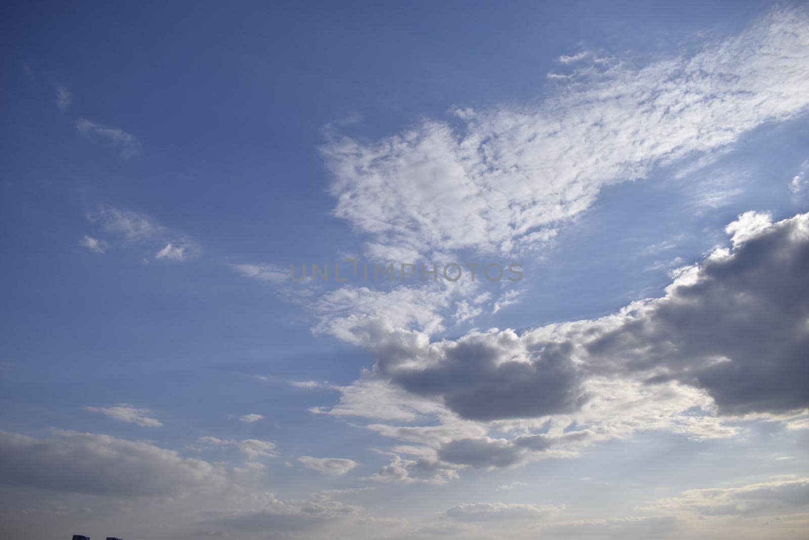 Blue sky and white clouds. Beautiful movement clouds in the sky. The formation of rain clouds.