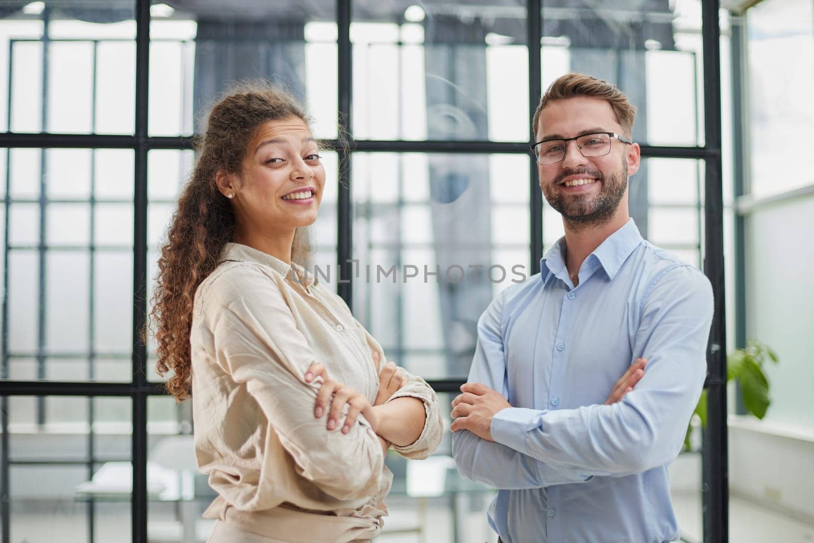 business people in the office arms crossed