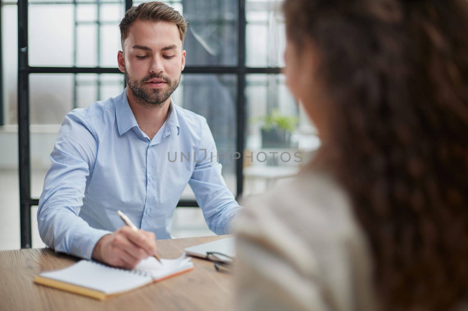 Handsome bearded man in a modern office