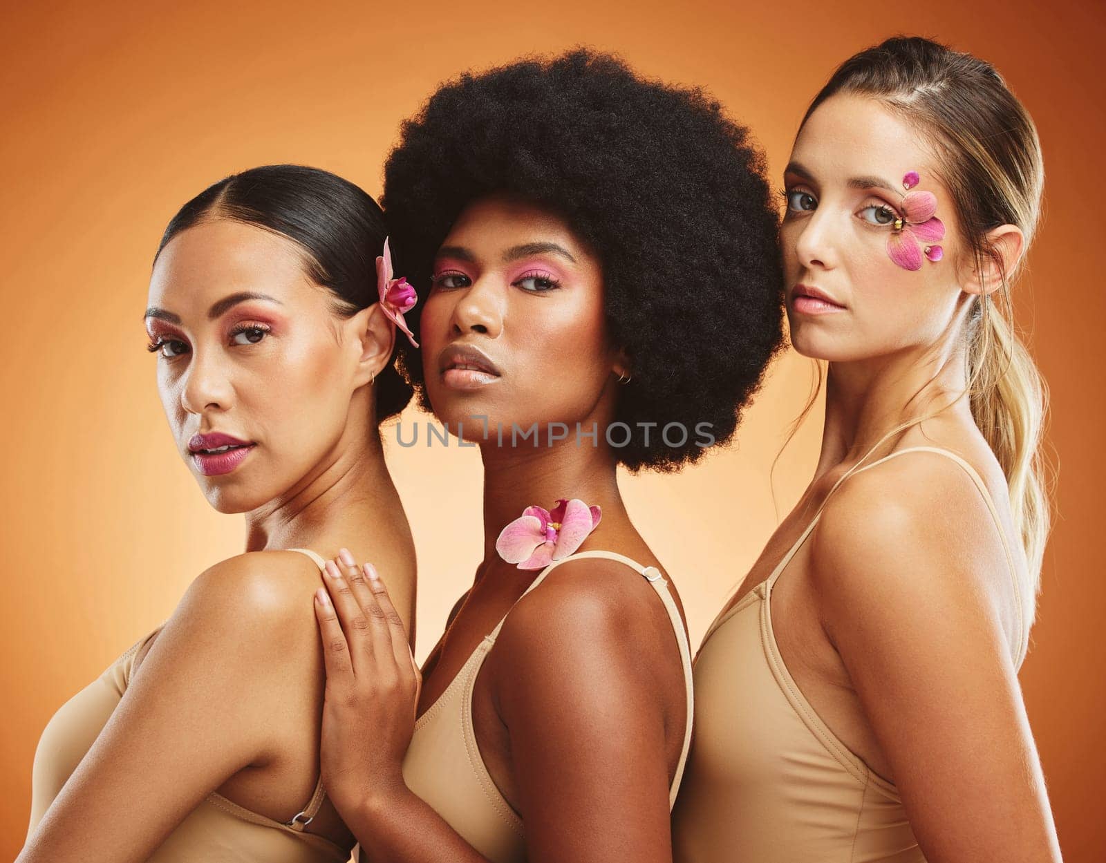Diversity, skincare and beauty with model woman friends on a brown background in studio for makeup or wellness. Portrait, empowerment and natural with a female group posing together for inclusion.