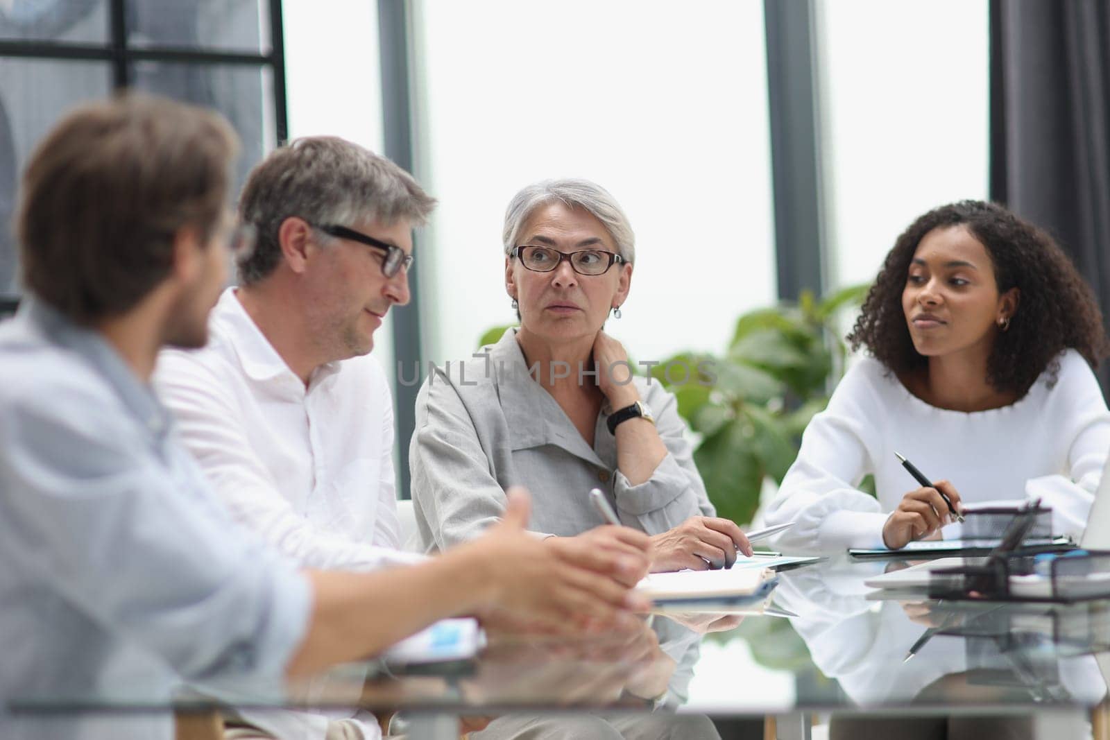 Conversation between managers and employees in the office