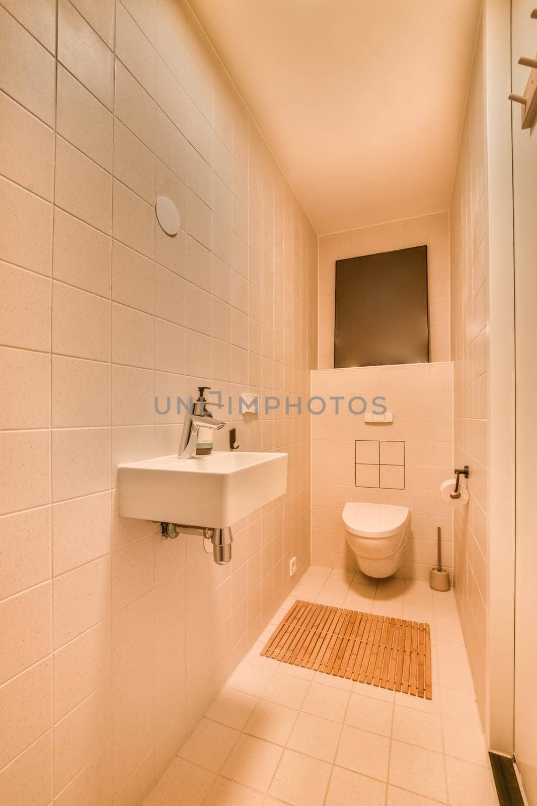 a bathroom with a sink, mirror and toilet paper on the wall next to the bathtub in the shower