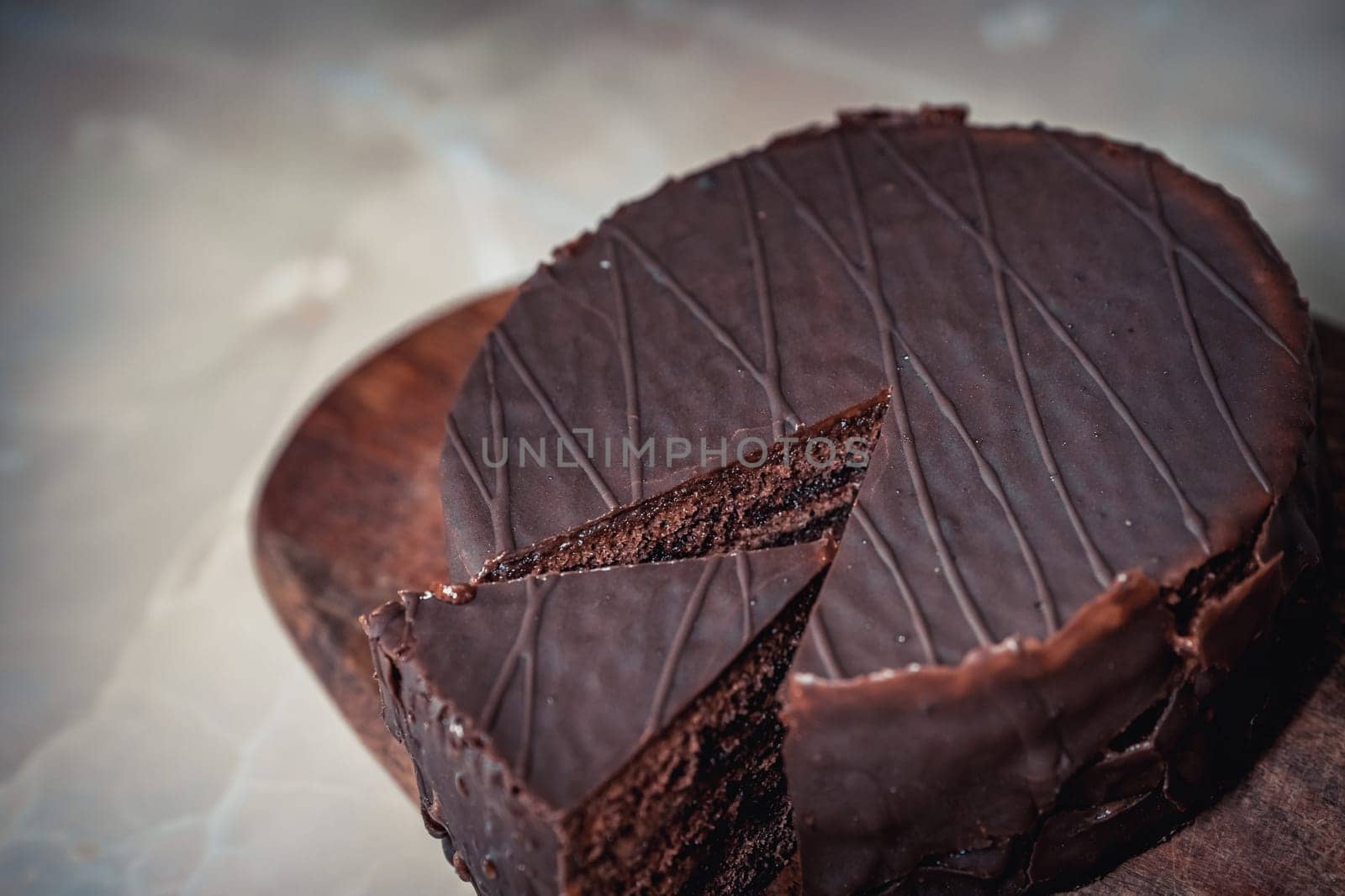 Round chocolate cake with triangular slice cut off by krol666
