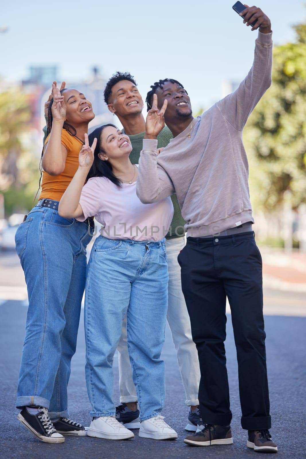 Friends, selfie with peace, urban and group photography in street, smartphone and travel with youth in Washington DC. Phone, social media content and smile in picture, v hand sign and trip outdoor. by YuriArcurs