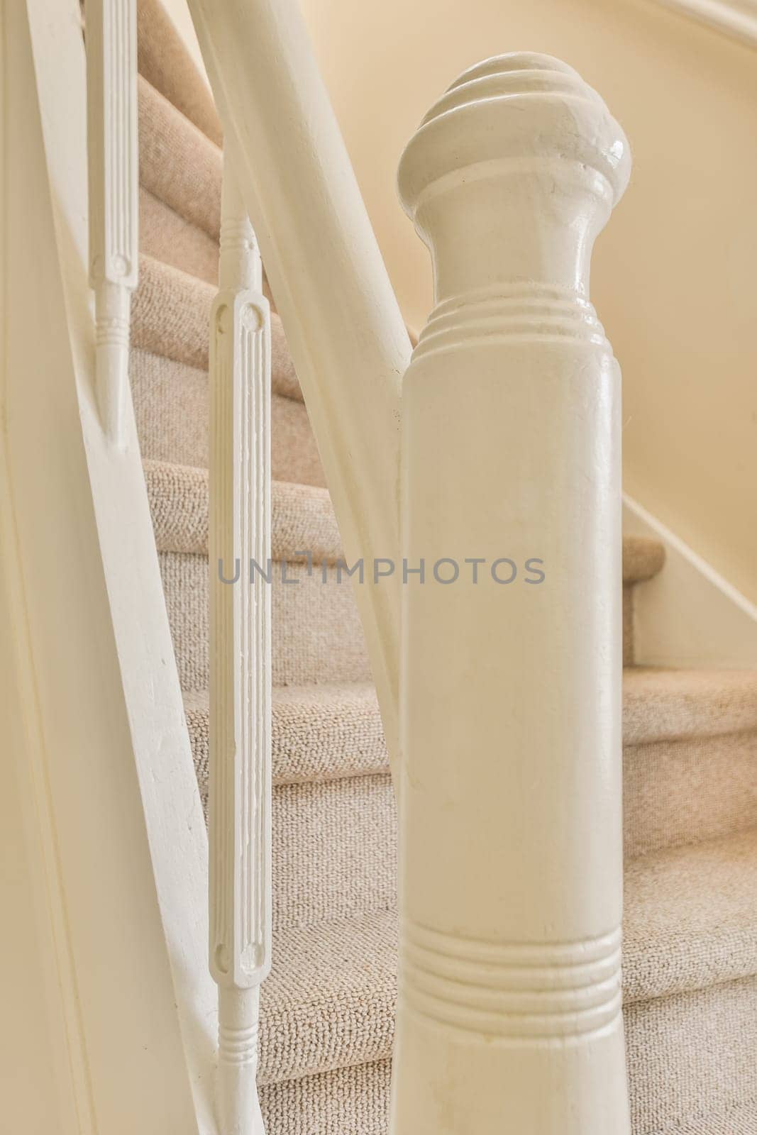 a staircase with a white railing and carpeted stairs by casamedia