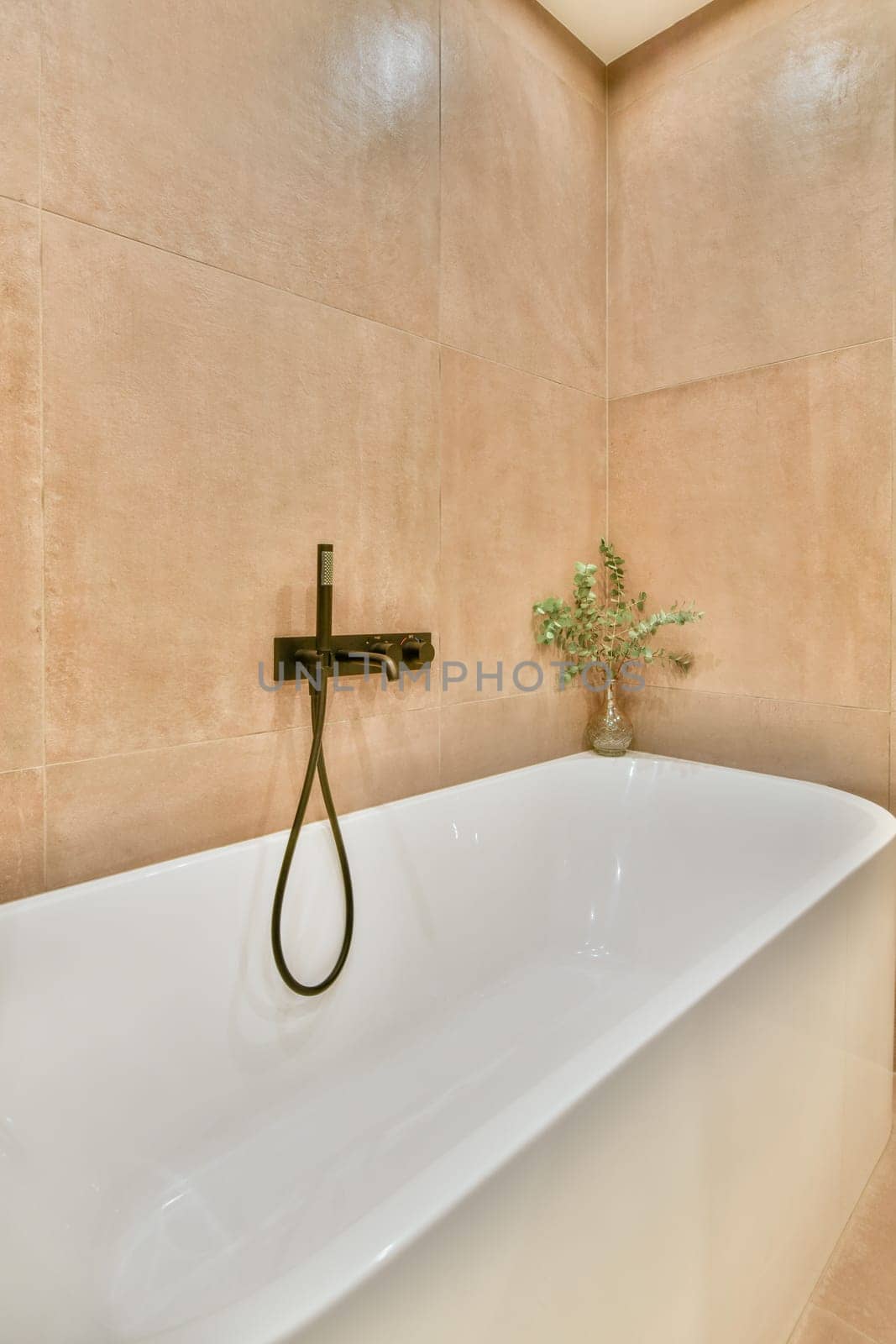 a white bathtub in the corner of a bathroom with a plant on it's side and an open window