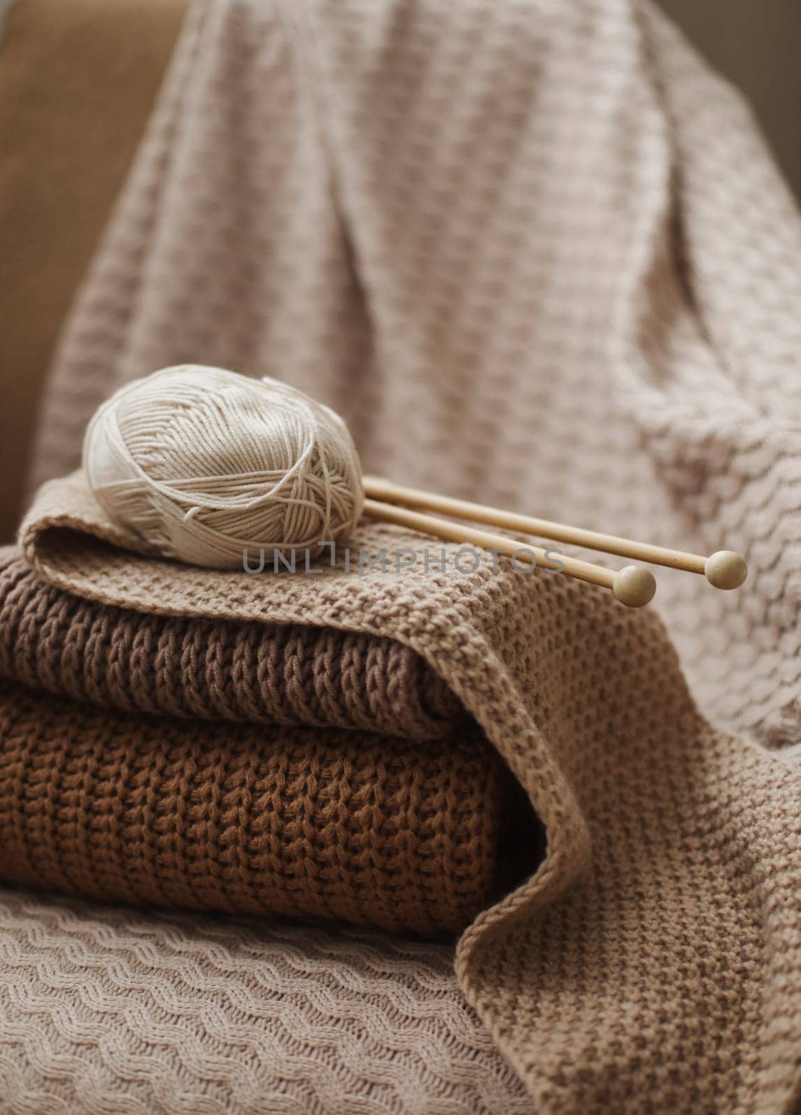 Close-up of wool and needles for knitting on the table