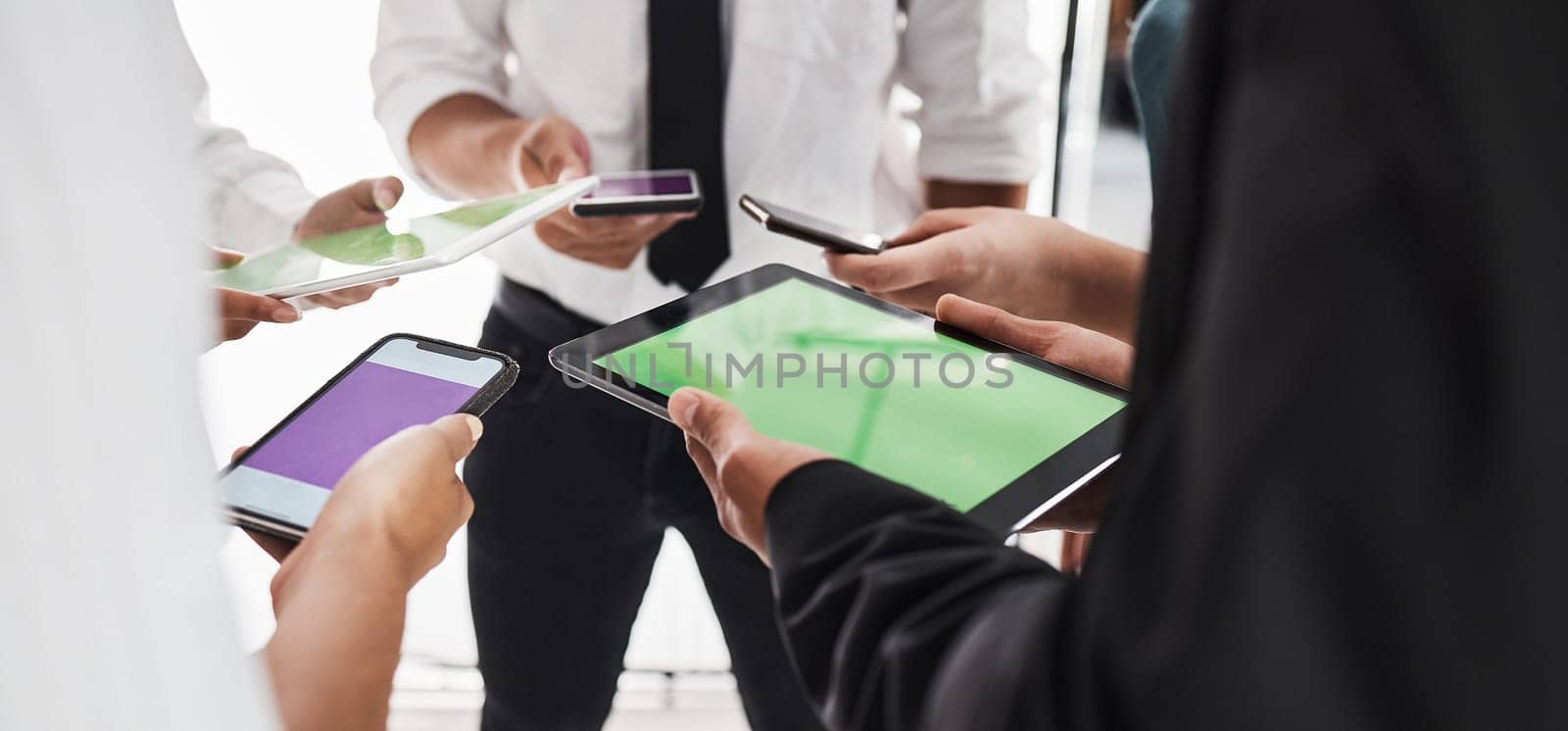 Hands, green screen and technology with a business team in studio isolated on a white background for communication or networking. Tablet, phone and mockup with an employee group on blank space.