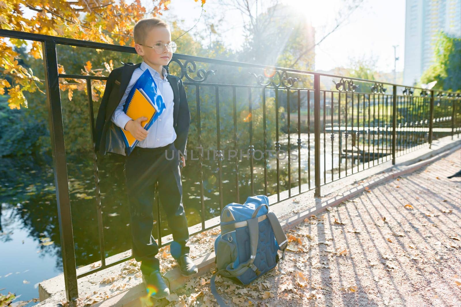 Back to school, portrait of boy with backpack, school supplies by VH-studio