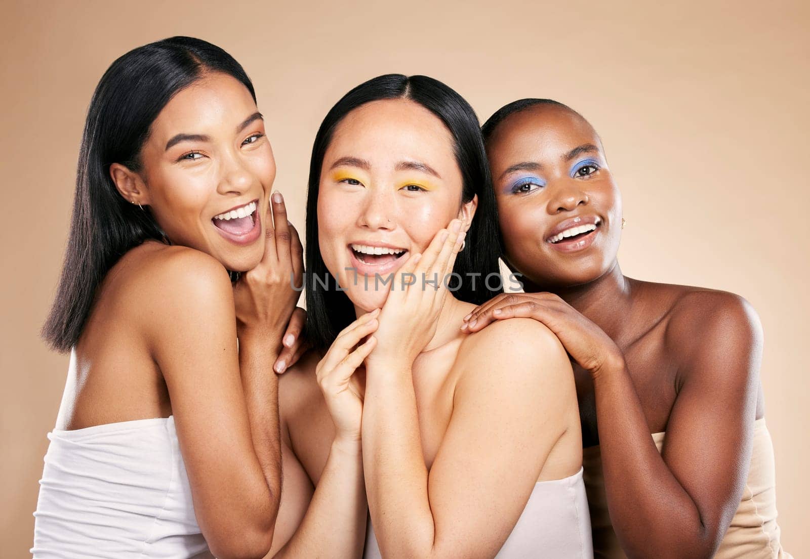 Happy women, portrait smile and diverse beauty for skincare, cosmetics or makeup against a studio background. Female friends or model face smiling in happiness for fun healthy skin treatment.