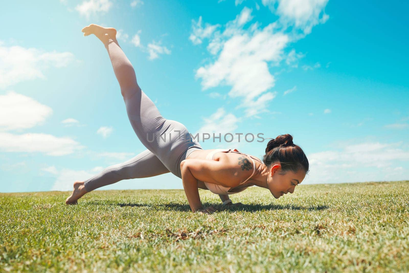 Meditation, energy and woman doing yoga on a field for zen, fitness and exercise in nature. Pilates, wellness and sports lady plank, training and practicing posture, strength and balance handstand by YuriArcurs