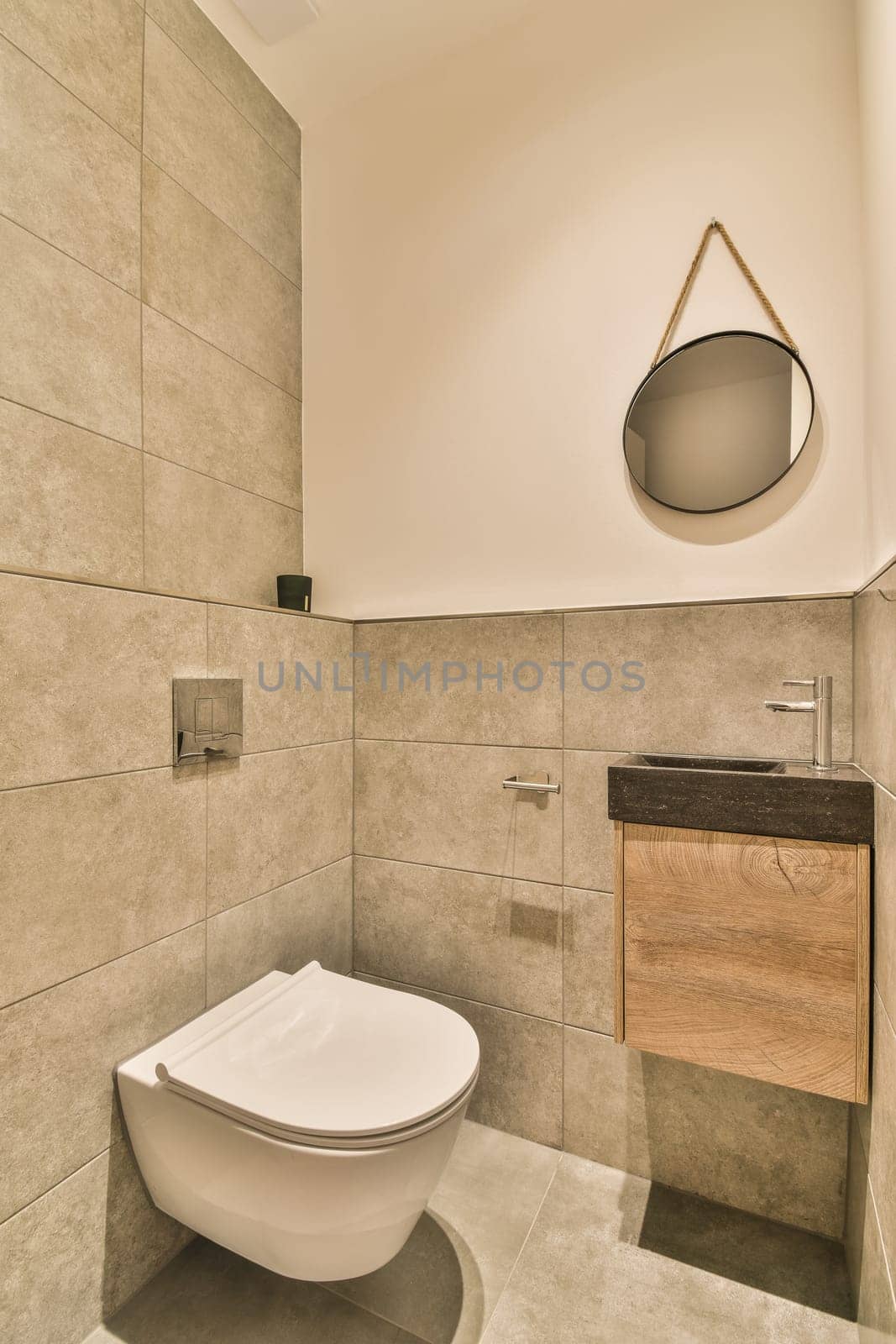 a small bathroom with a toilet and wooden cabinet in the corner, which is also used as a washroom