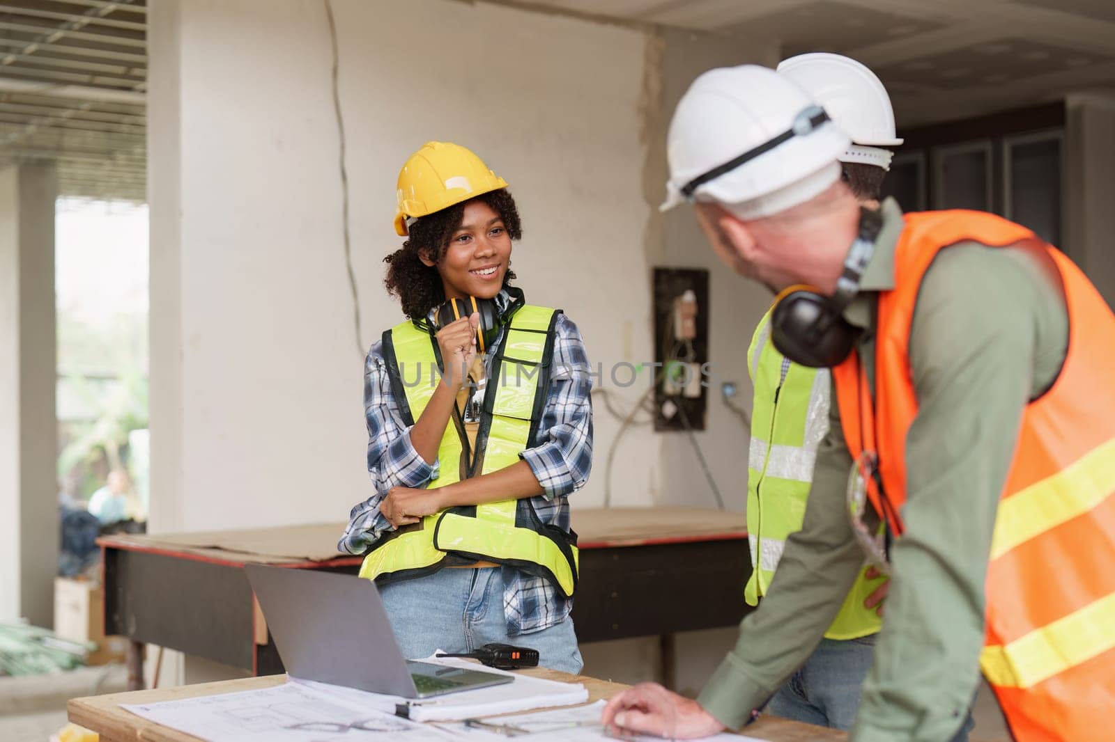 American African Foreman builder woman at construction site. Foreman construction and Engineer working at construction site.