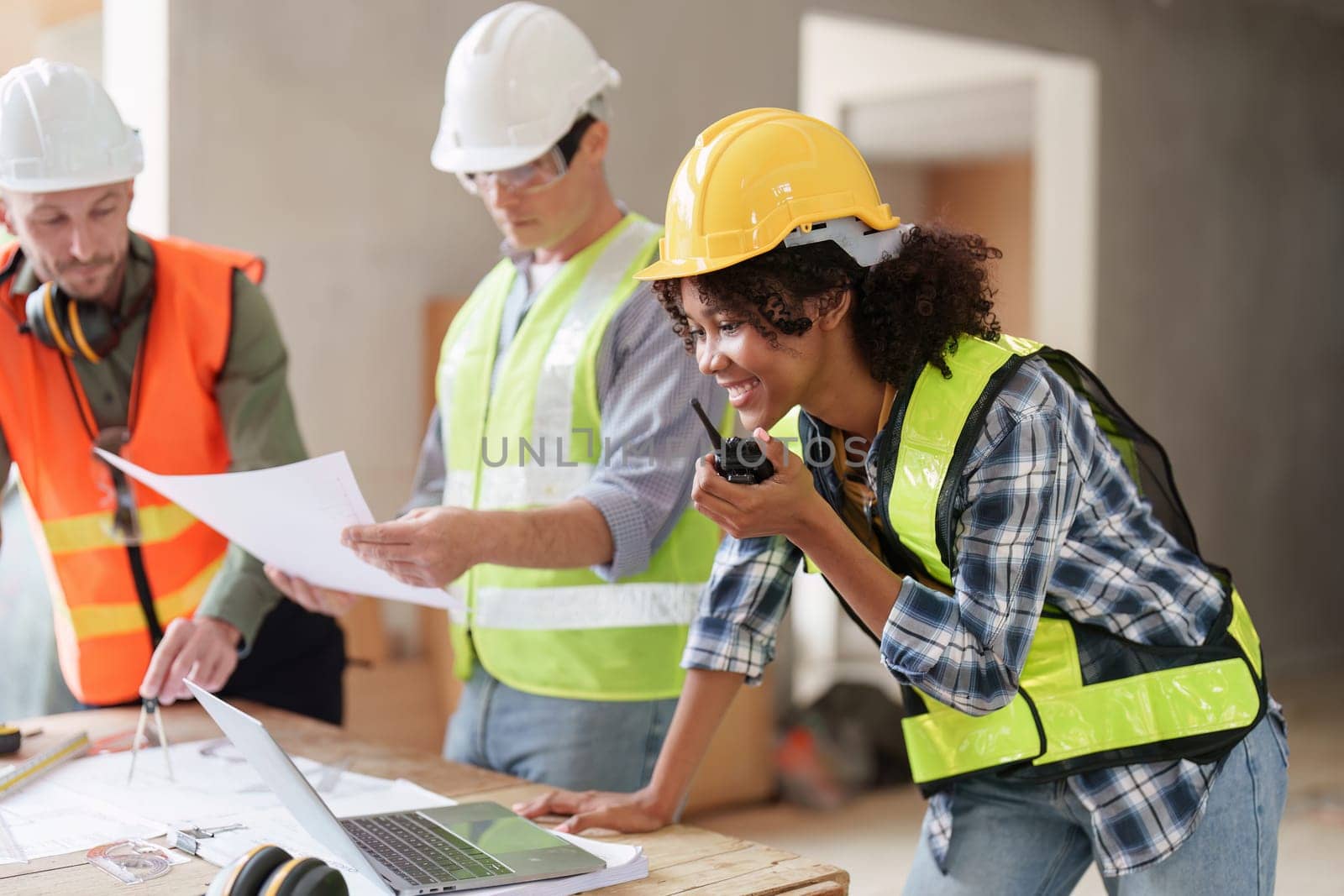 American African Foreman builder woman at construction site. Foreman construction and Engineer working at construction site.