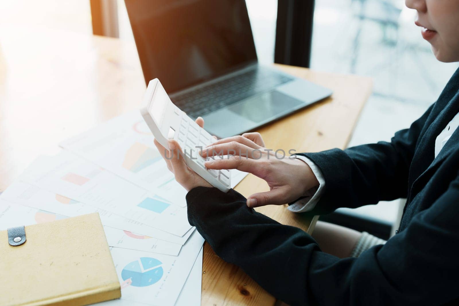 financial, Planning, Marketing and Accounting, portrait of Asian employee checking financial statements using documents and calculators at work..