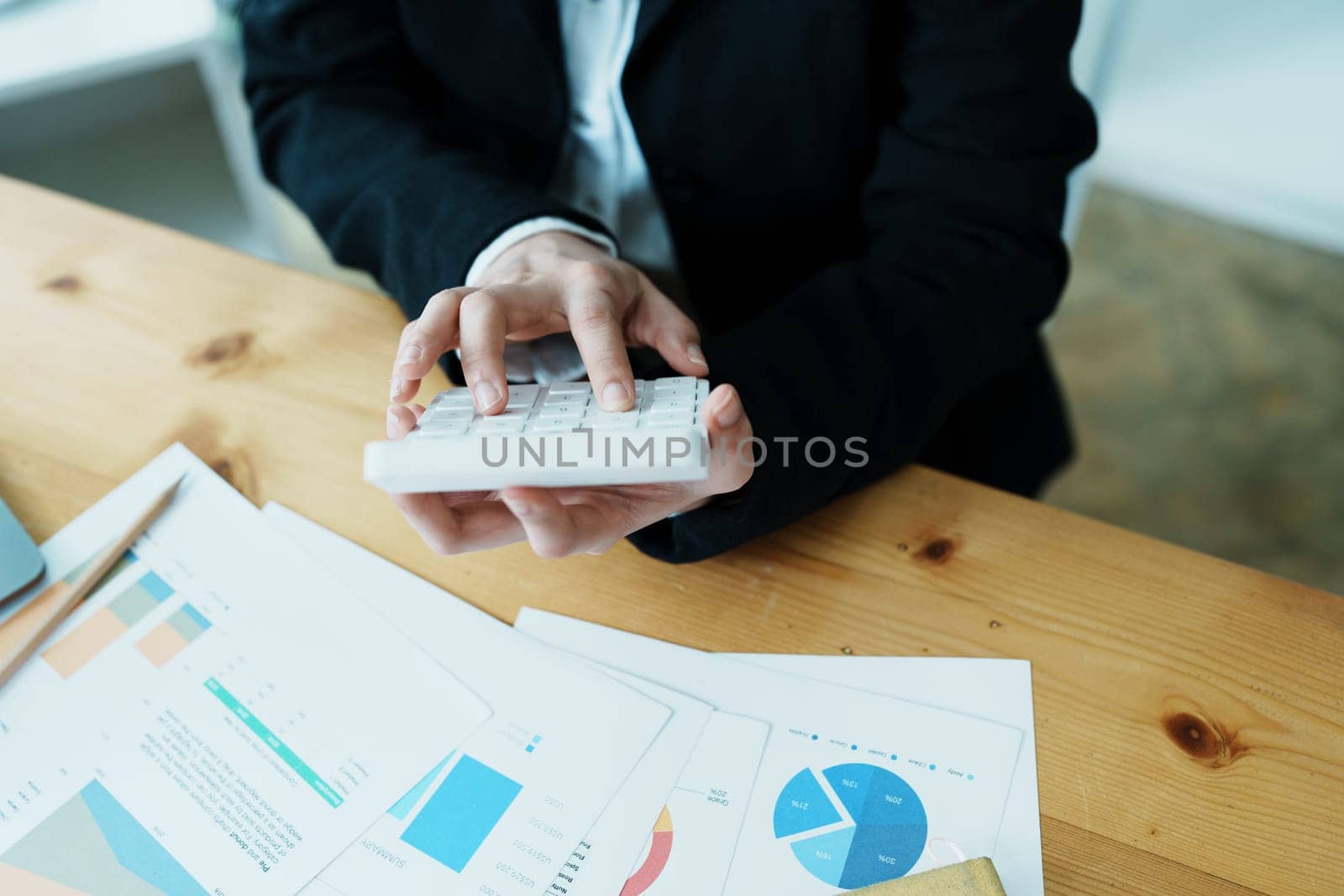 financial, Planning, Marketing and Accounting, portrait of Asian employee checking financial statements using documents and calculators at work..