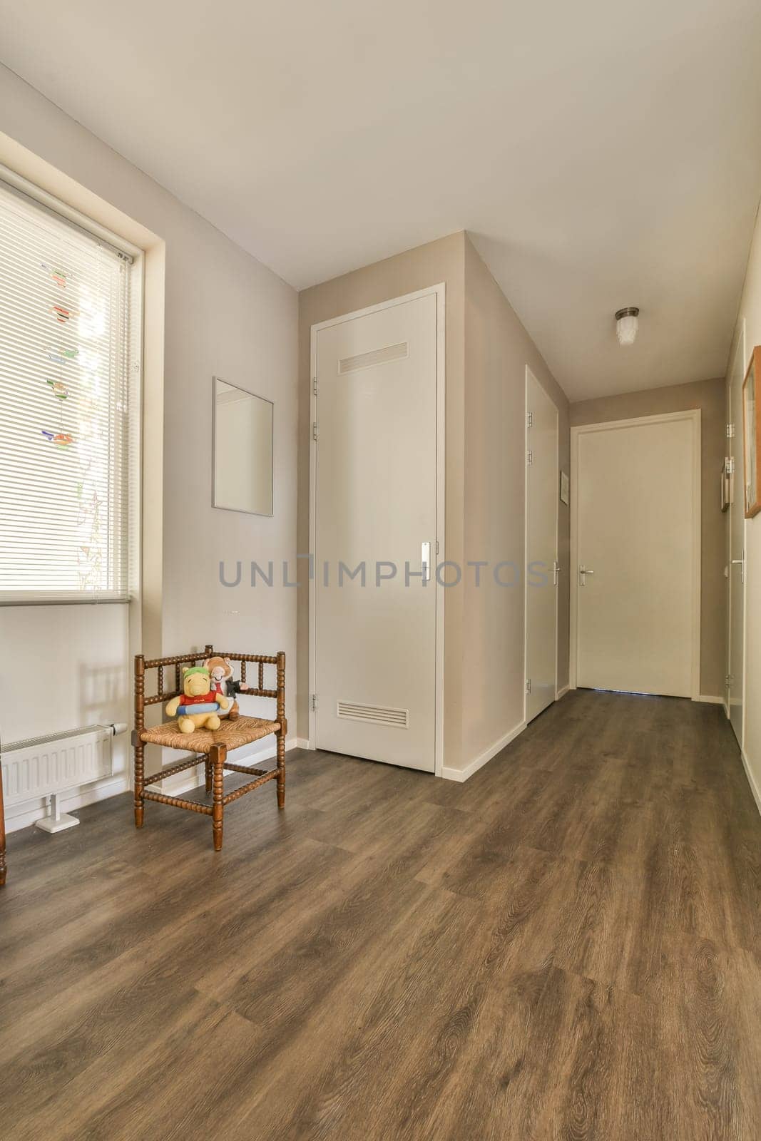 an empty living room with wood flooring and white trim on the walls in this photo is taken from inside